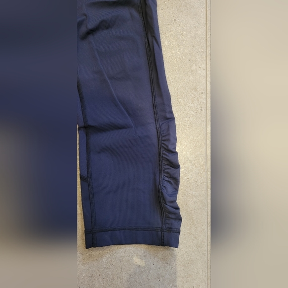 Lululemon navy blue cropped pants with side pockets and back storage pocket. - Picture 2 of 8